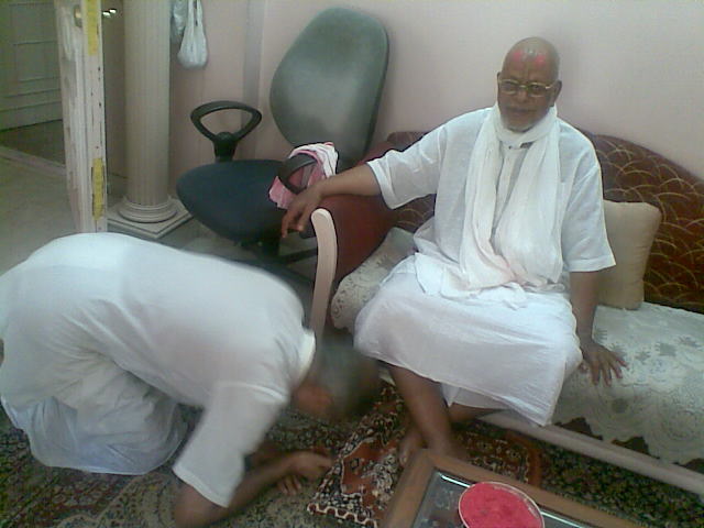 Baba bestowing mercy on Sanjay Bhaisab