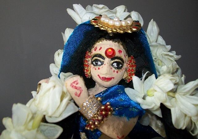 bewitching smile, and golden tiara.