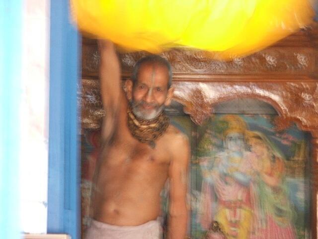 Prankrishna Baba pulling the curtain for bhog