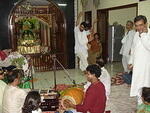 Baba enjoying kirtan sung for Sri Radha-Nikunjabehari  (dadabhai's Deities).