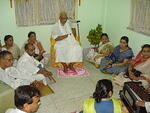 Ishta-goshthi with Baba in the centre.