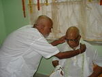 Uncle Narayan garlanding Baba