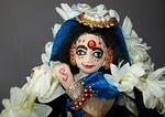 bewitching smile, and golden tiara.